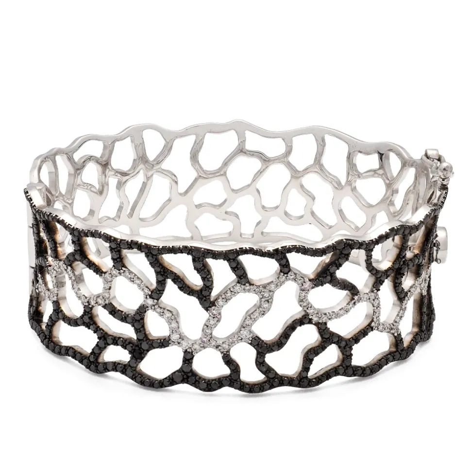 Pulsera calada de oro blanco con diamantes blancos y negros