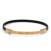 Pulsera fina de bronce y oro con notas musicales