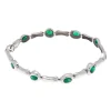 Pulsera oval de oro blanco y esmeraldas