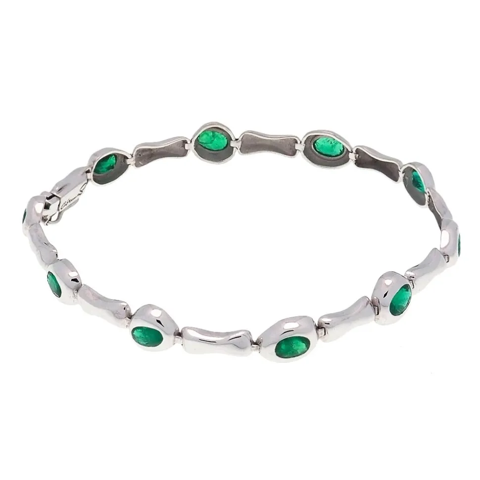 Pulsera oval de oro blanco y esmeraldas